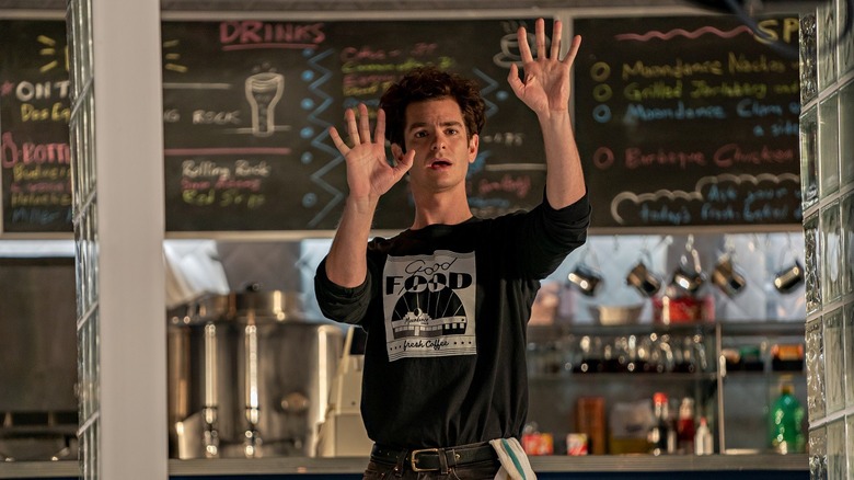 Andrew Garfield raising hands