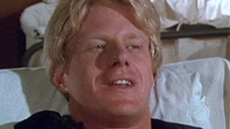 Ed Begley Jr. in a bed in MASH