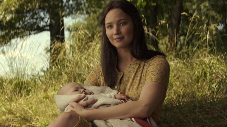 Katniss holding a baby