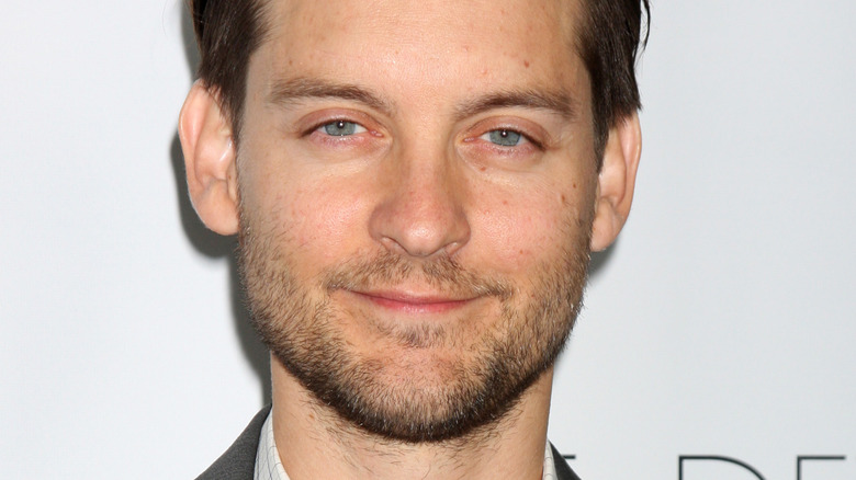 Tobey Maguire smiling blandly