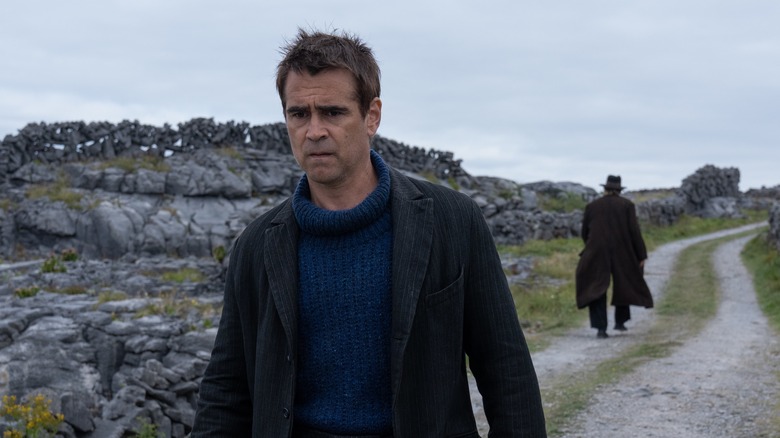 Colin Farrell walking away from Brendan Gleeson