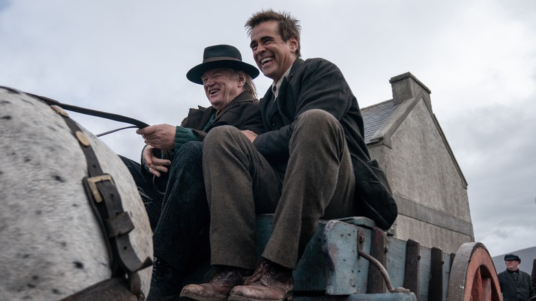 Colin Farrell and Brendan Gleeson on a wagon