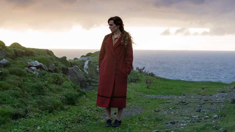 Kerry Condon standing on some rocks