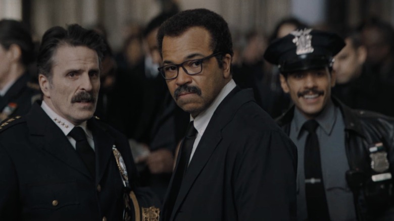 Jim Gordon standing with cops