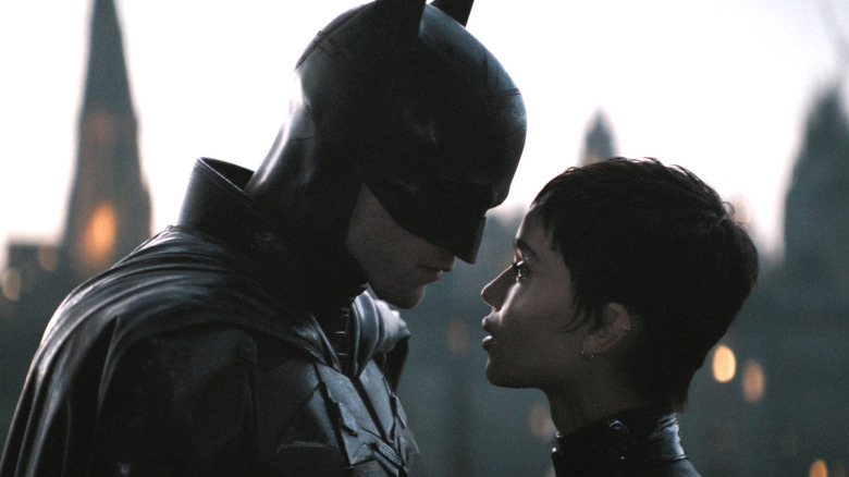 Batman and Catwoman looking at each other