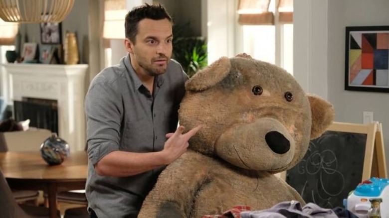 Nick Miller with a bear