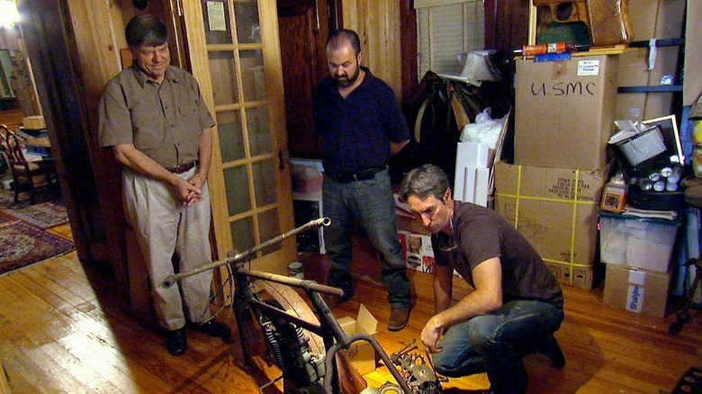 Mike Wolfe and Frank Fritz looking at a bike