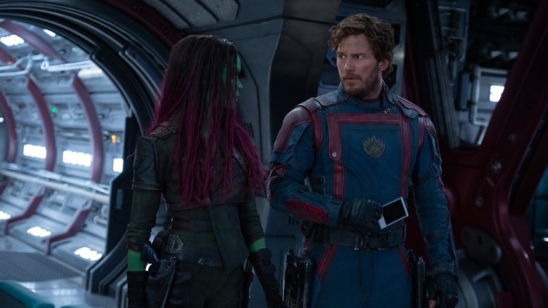 Gamora and Quill walking through spaceship