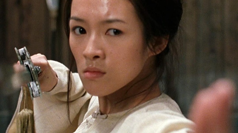 Jen Yu brandishing a sword