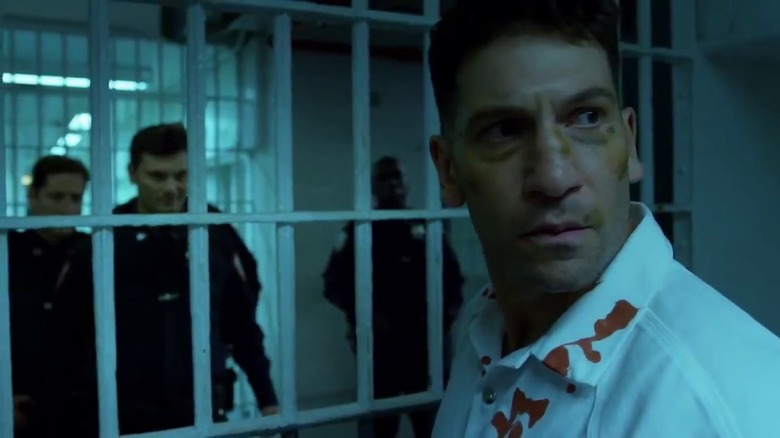 Frank Castle stands in prison cell