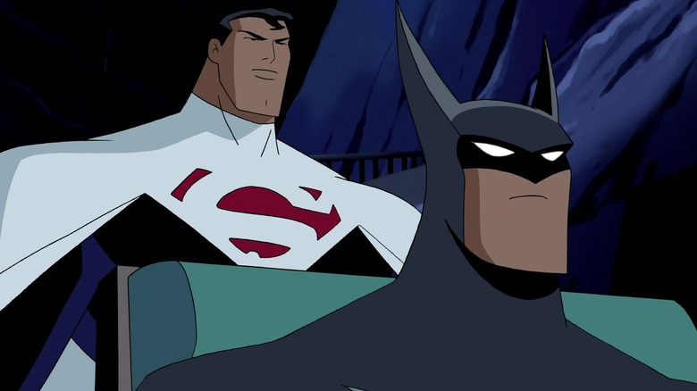 Justice Lords Superman stands behind Batman