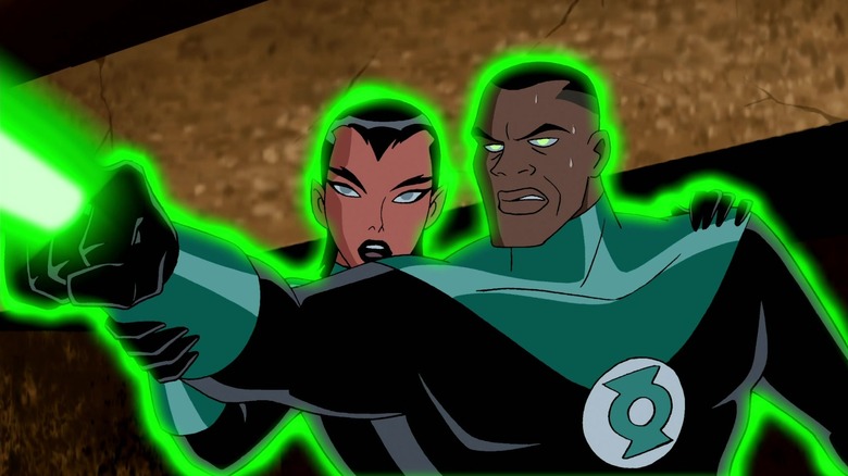 Katma Tui holding John Stewart's arm up