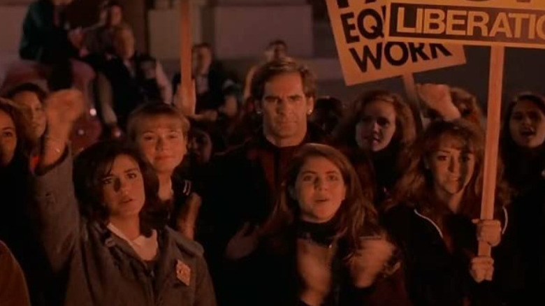 Sam as Margaret, supporting daughter Suzanne during a protest for Women's Rights