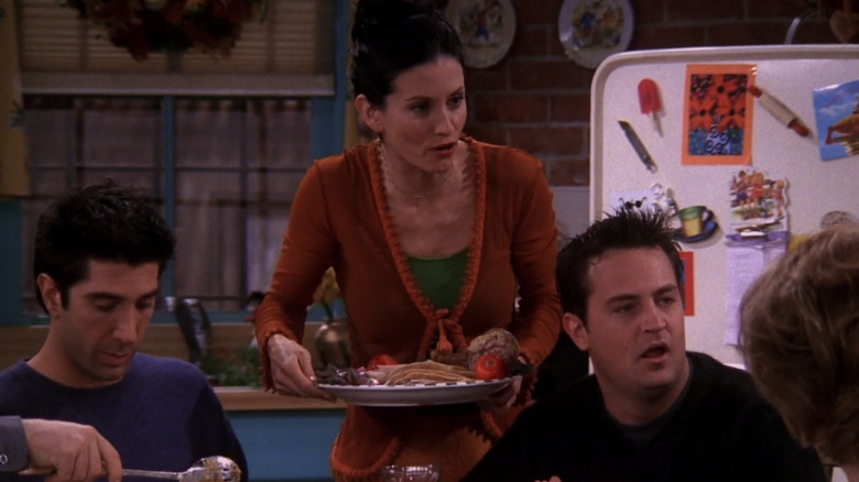 Monica Geller serving food on Friends