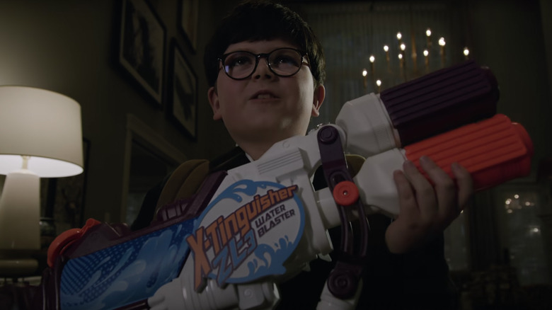 Max with a toy gun in Home Sweet Home Alone