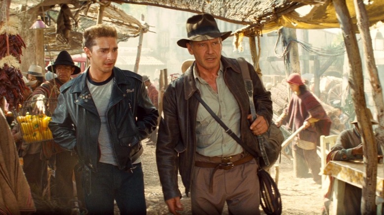 Shia LaBeouf and Harrison Ford walking through market