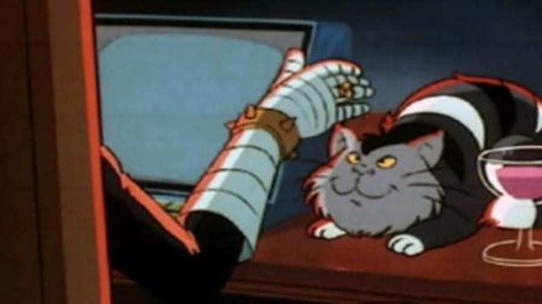 Dr. Claw's hand petting cat