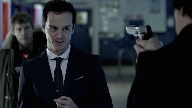 Sherlock points gun at Moriarty