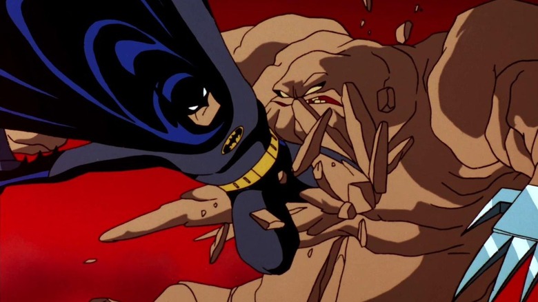 Batman kicks Clayface