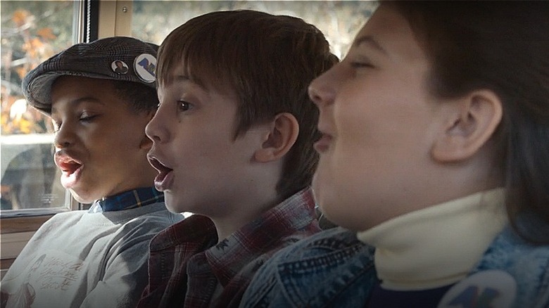 Randall, Kevin, and Kate singing in Jeep