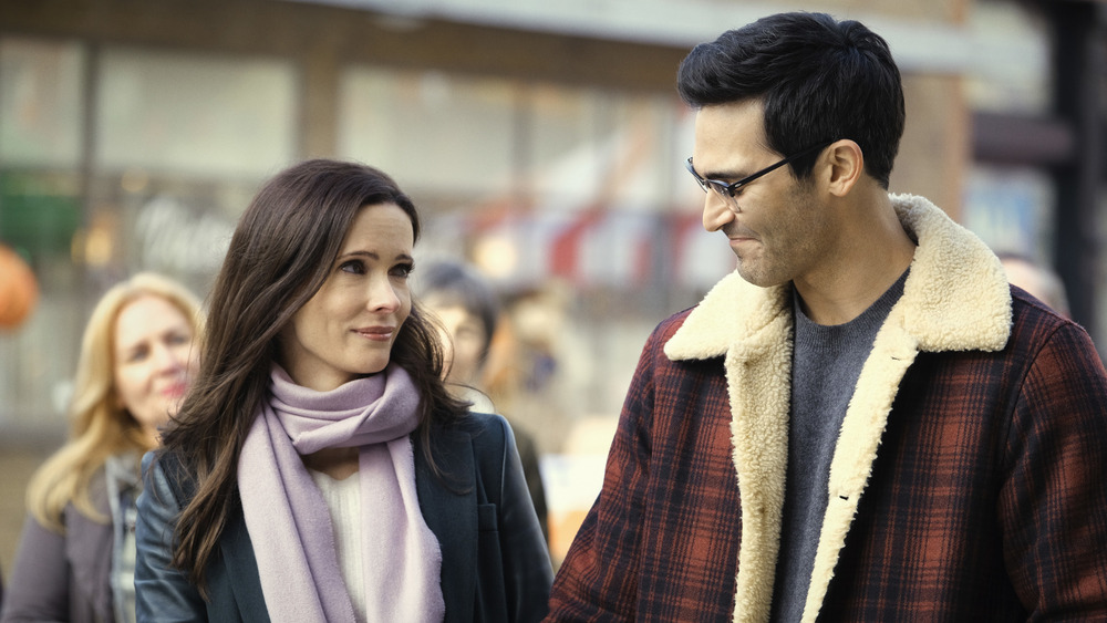 Lois Lane and Clark Kent smiling at one another