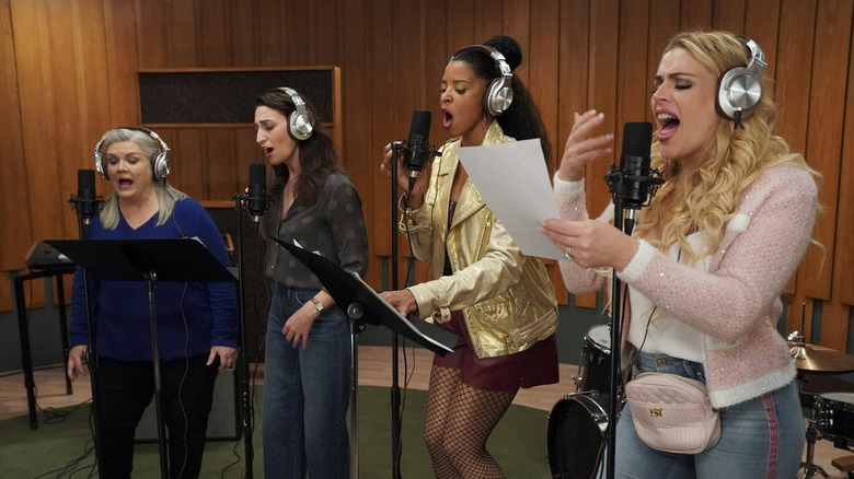 The members of Girls5eva sing in the studio