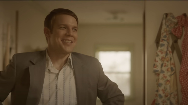 Jake Lacy with hands on hips