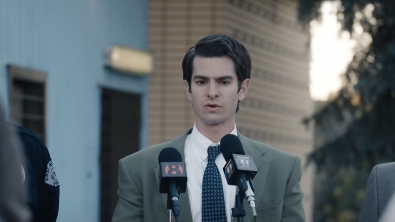 Andrew Garfield speaks into a microphone