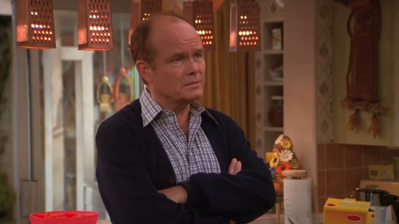 Red Forman crossing arms