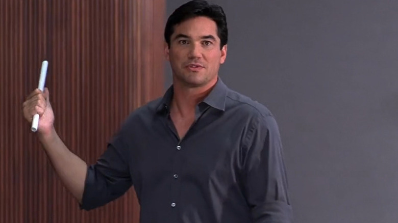 Dean Cain points behind him