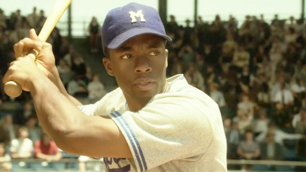 Chadwick Boseman as Jackie Robinson in 42