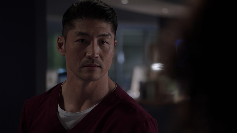 Dr. Ethan Choi wearing red scrubs