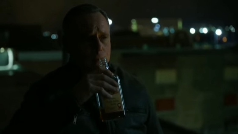 Hank Voight drinking on the roof