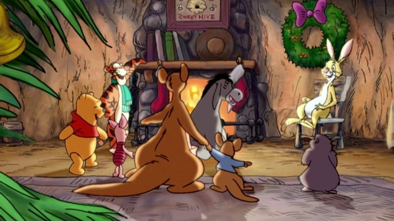 Pooh, Tigger, Piglet, Kanga, Roo, Eeyore, Rabbit, and Gopher singing together by a campfire in Winnie the Pooh: A Very Merry Pooh Year (2002)