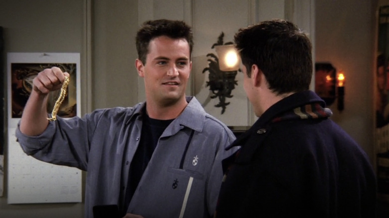 Chandler holding a bracelet on Friends