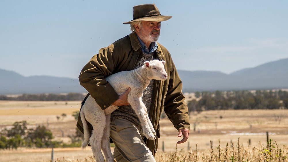 Sam Neill carries friend