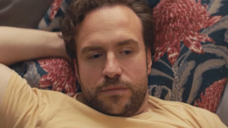 Rafe Spall lying in bed