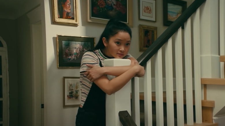 Lara Jean hugging banister