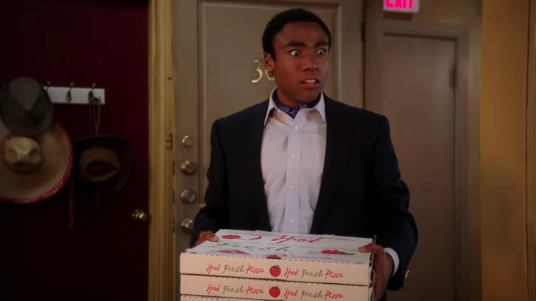 Troy Barnes with pizza