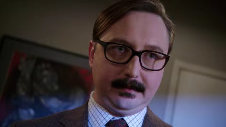 John Hodgman with ominous lighting