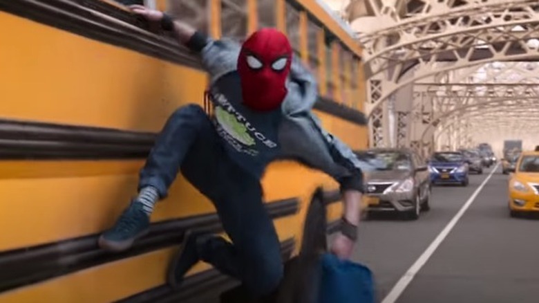 Spider-Man hangs off bus