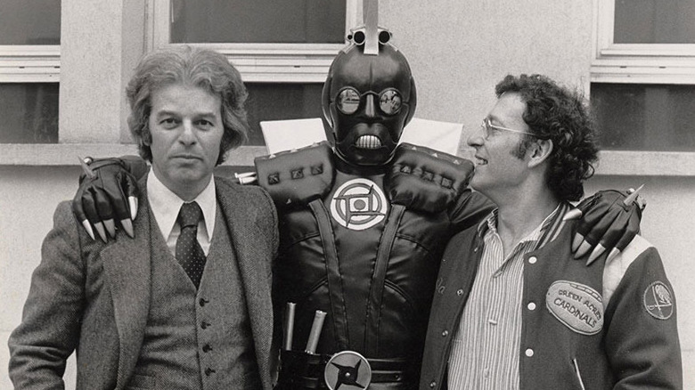 Alejandro Jodorowsky and a man in a leather suit