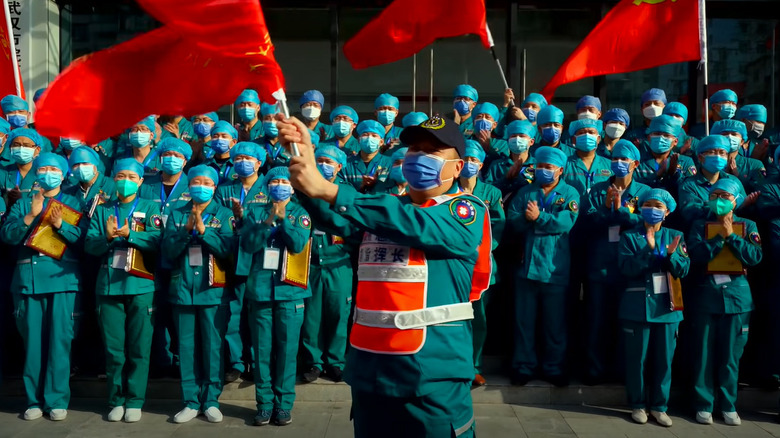 Chinese healthcare workers with flags