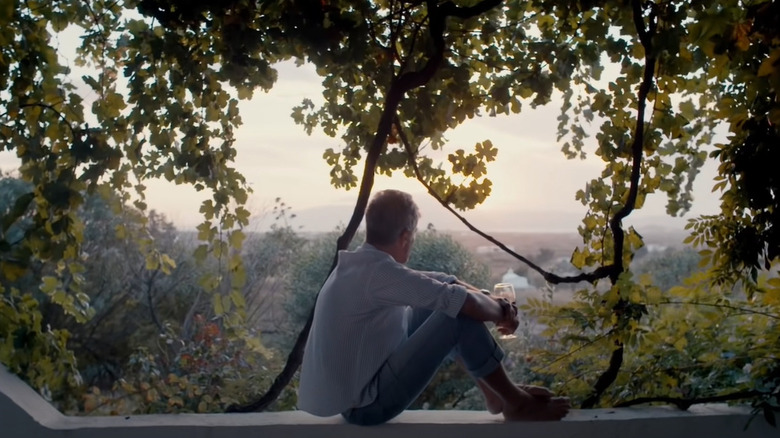 Anthony Bourdain sitting on balcony