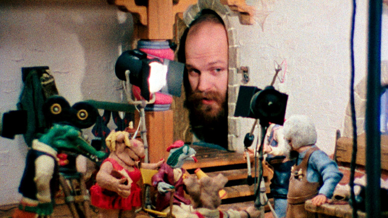 Will Vinton looking over his stop-motion puppets