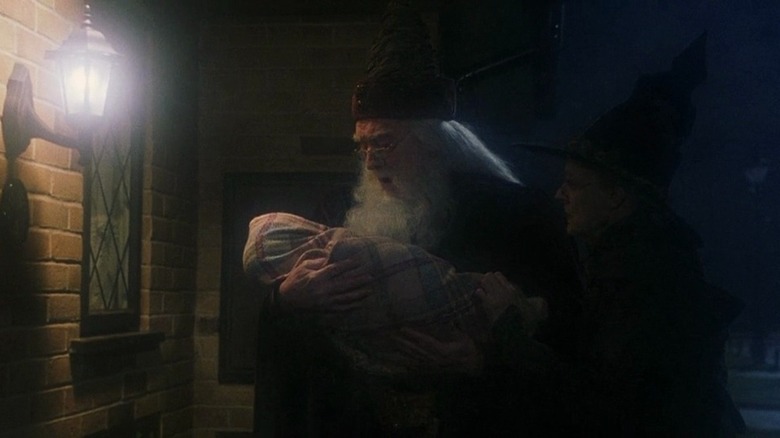 Dumbledore holding baby Harry