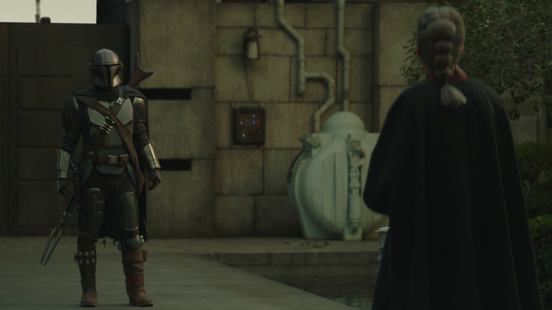 The Mandalorian facing the Magistrate