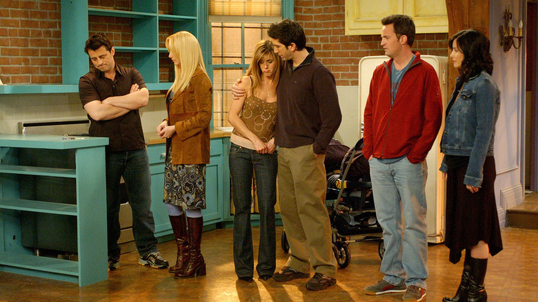 Friends cast in empty kitchen