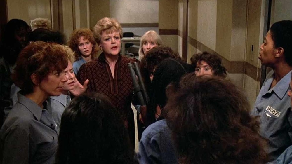 Jessica Fletcher talks to a throng of reporters