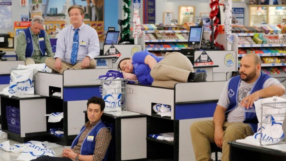 Superstore cast sits on checkouts